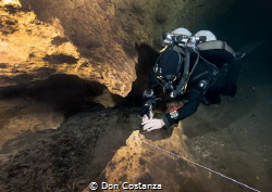 Tying wet rocks together by Don Costanza 